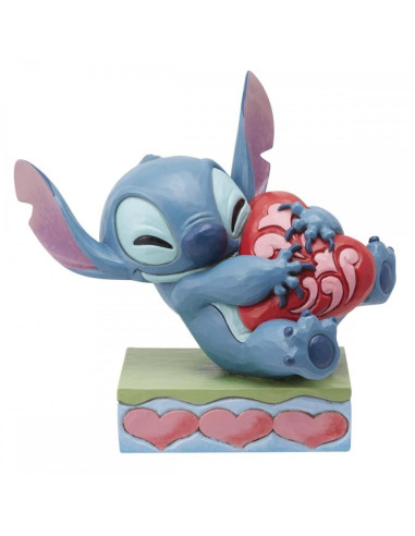 Figura enesco disney stitch abrazando un corazón